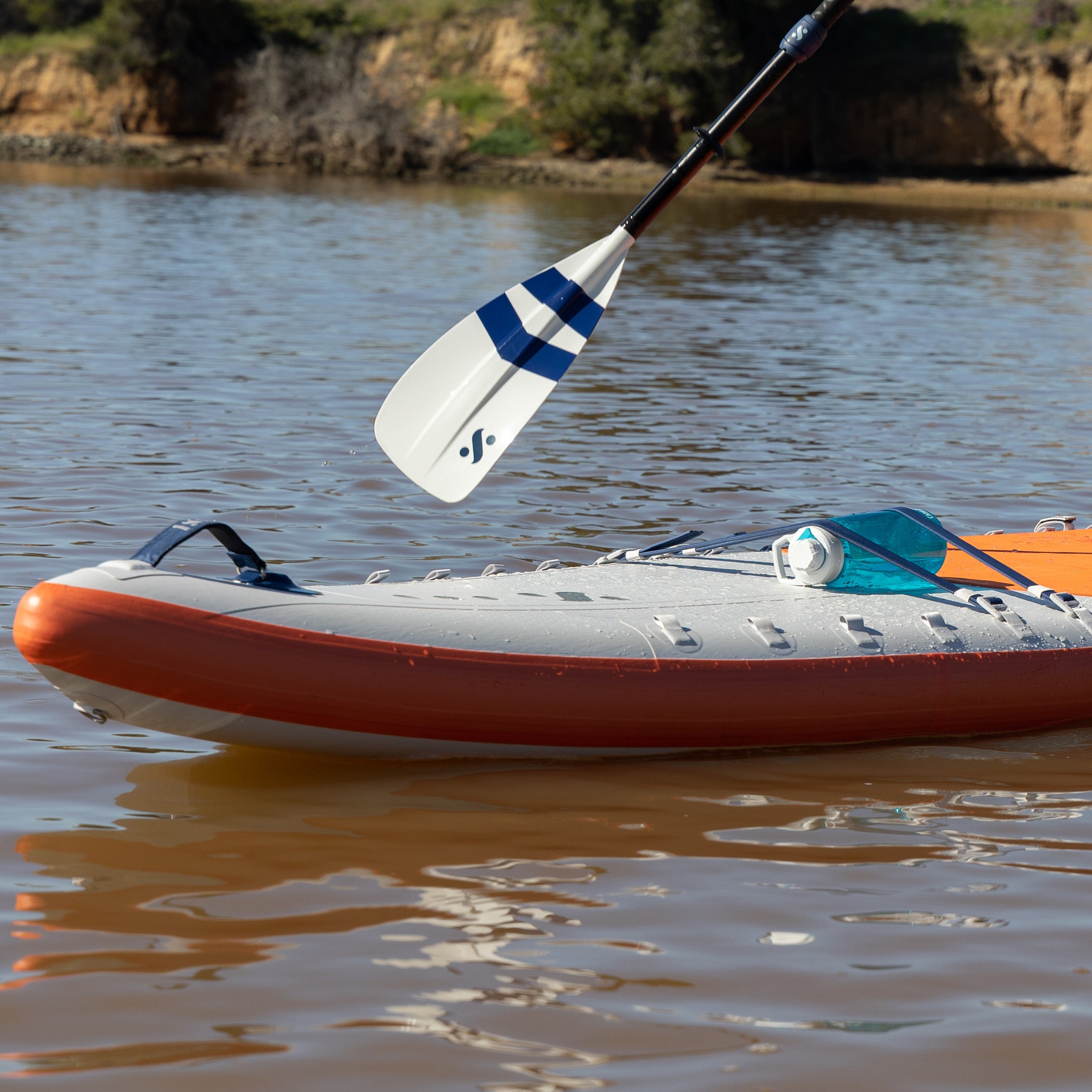 Someone Paddle Boarding Using The Remix Alloy 4 Piece SUP-Kayak Paddle