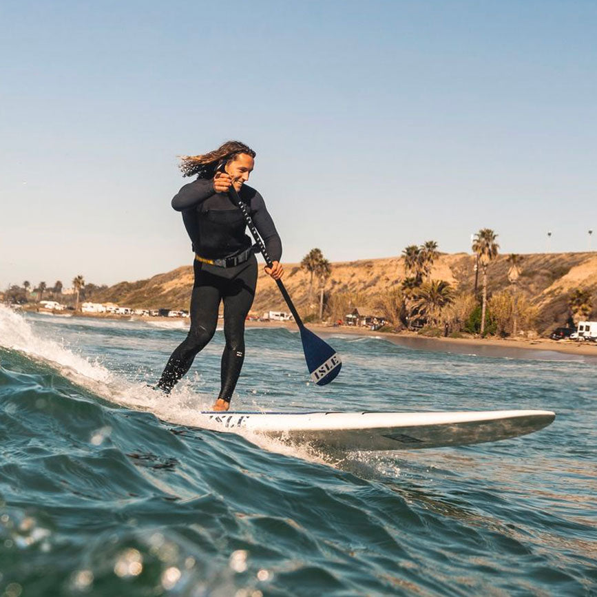 Man SUP Surfing  On The Versa 2.0 Paddle Board With The Carbon Elite Fixed Length SUP Paddle
